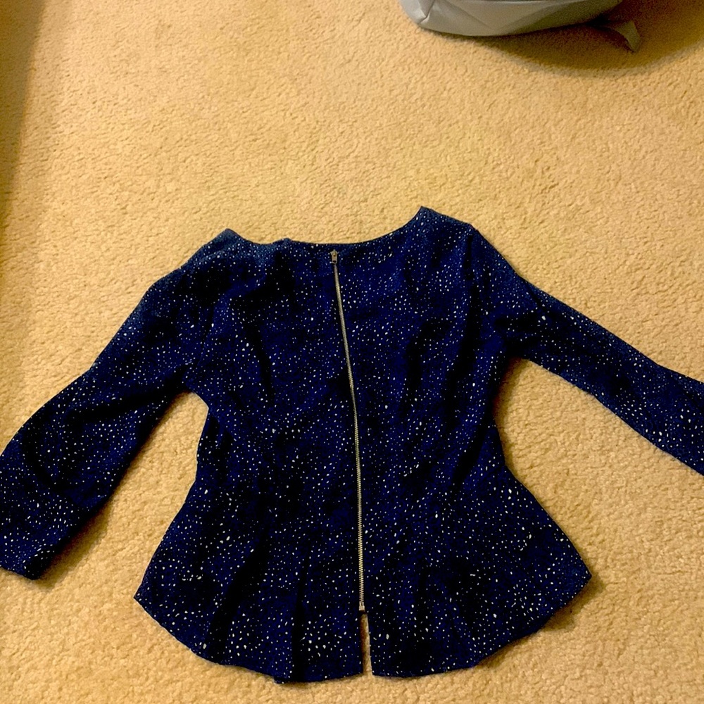 This is a zip up shirt it is a size S and it is from Forever 21.